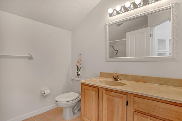 bathroom with vanity, a textured ceiling, a shower, tile patterned floors, and toilet