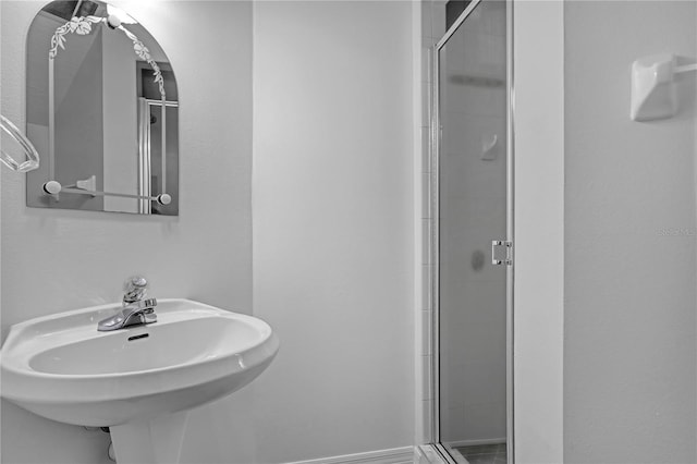 bathroom featuring sink and walk in shower