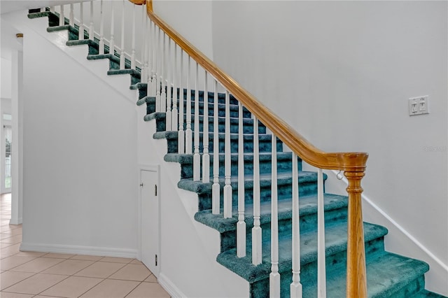 stairs with tile patterned flooring