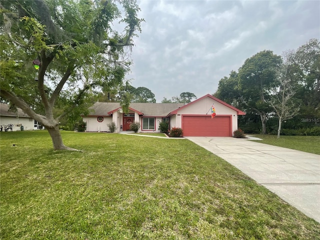 single story home with a garage and a front lawn