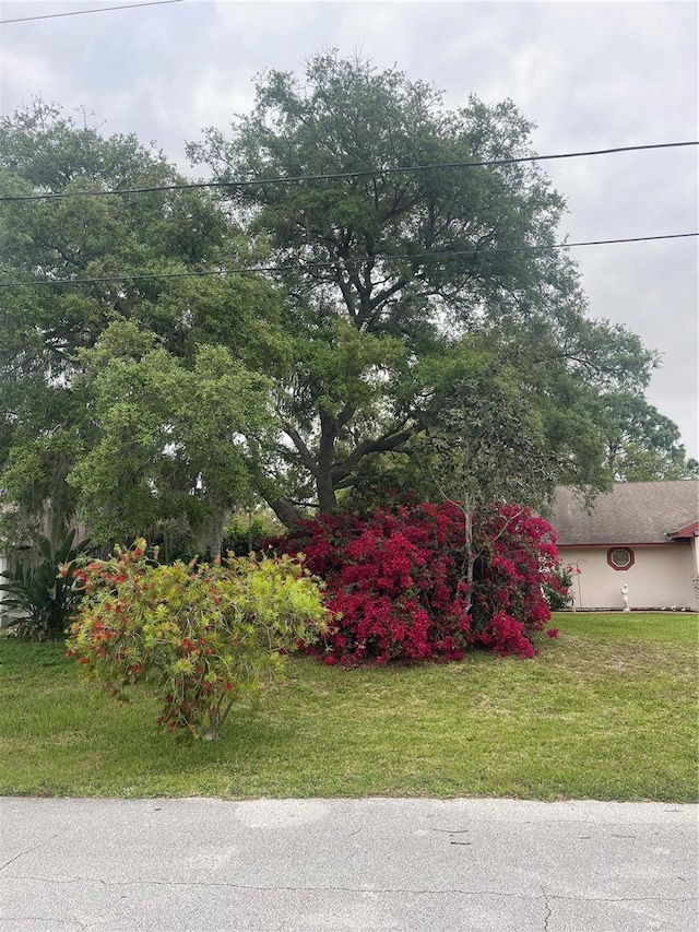 view of side of home with a lawn