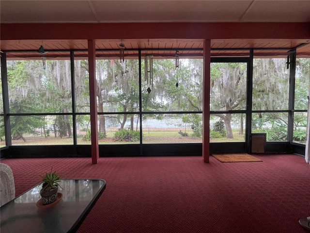 unfurnished sunroom featuring plenty of natural light