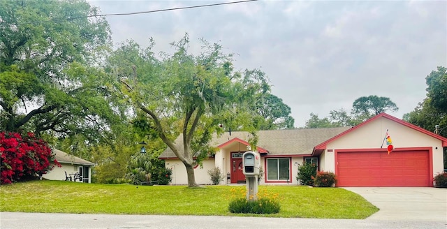 ranch-style house featuring a garage and a front lawn