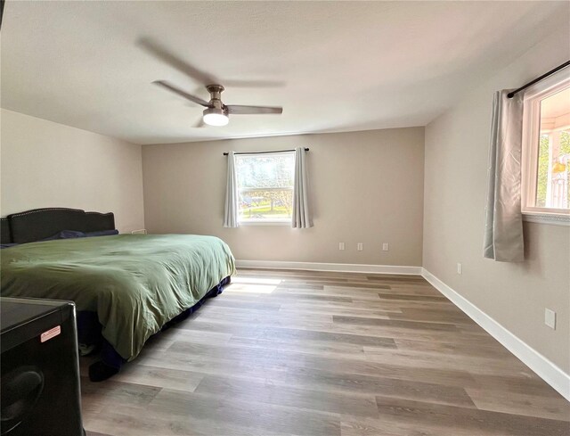 bedroom featuring ceiling fan and light wood-type flooring