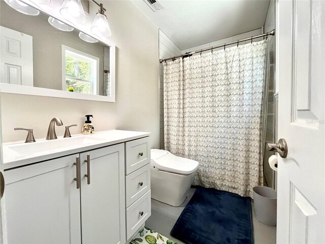 bathroom with vanity and toilet