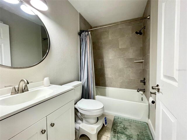 full bathroom featuring vanity, toilet, tile patterned flooring, and shower / bath combo with shower curtain