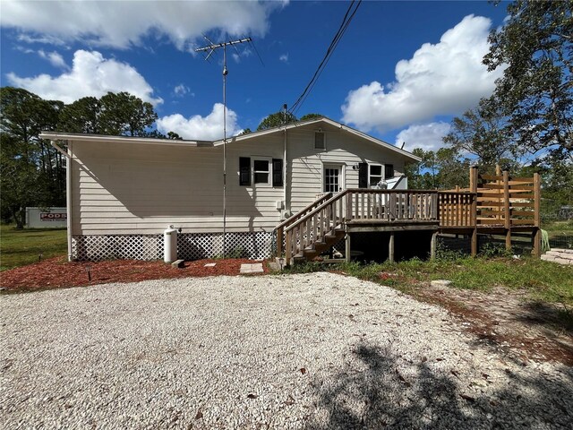 rear view of property with a deck