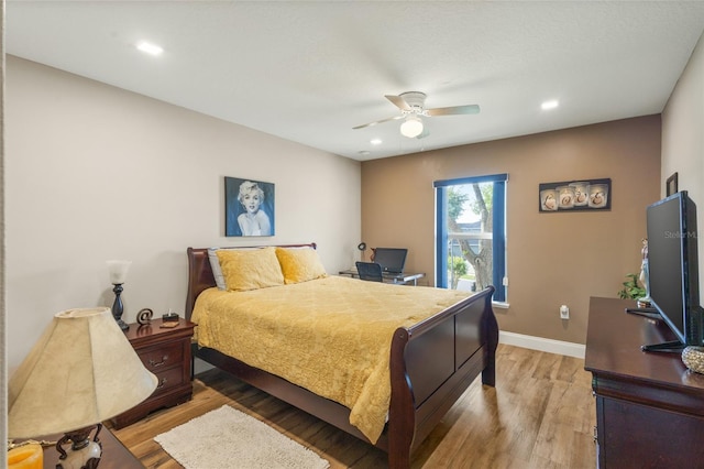 bedroom featuring ceiling fan and wood-type flooring