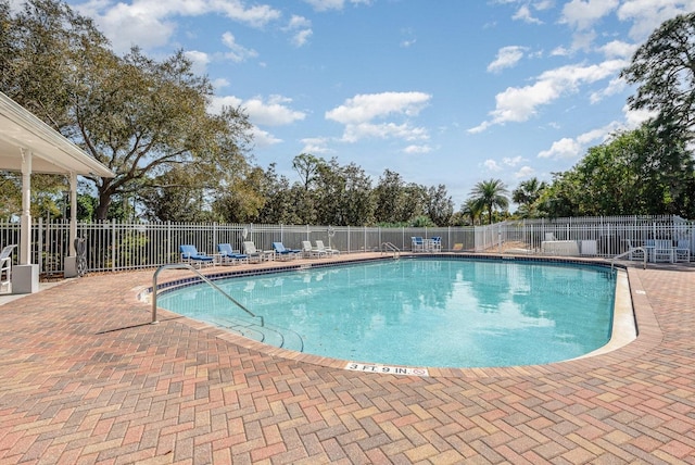 view of swimming pool with a patio area