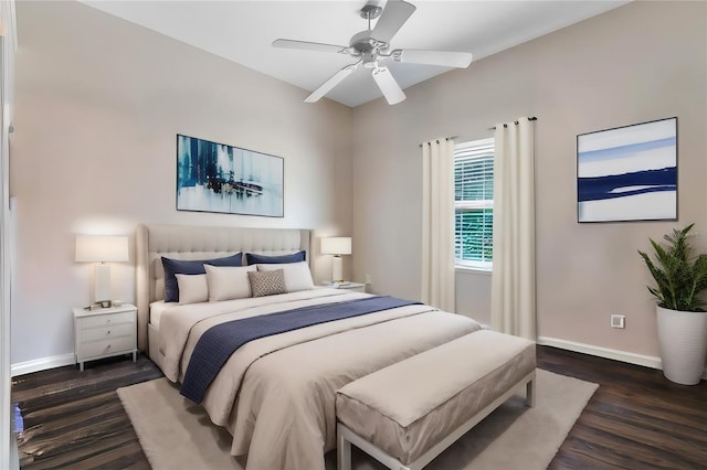 bedroom featuring ceiling fan and dark wood-type flooring