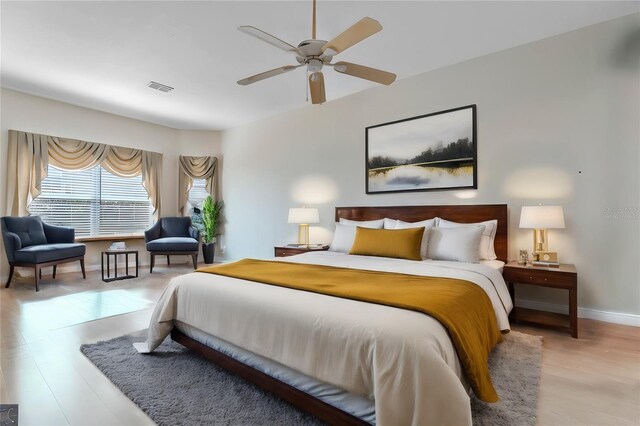 bedroom featuring ceiling fan and light hardwood / wood-style flooring