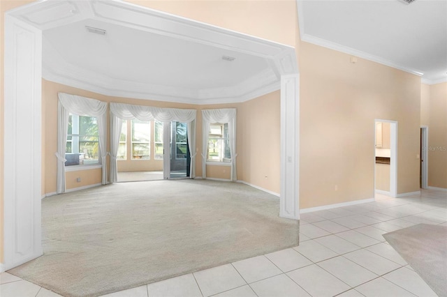 carpeted empty room featuring crown molding