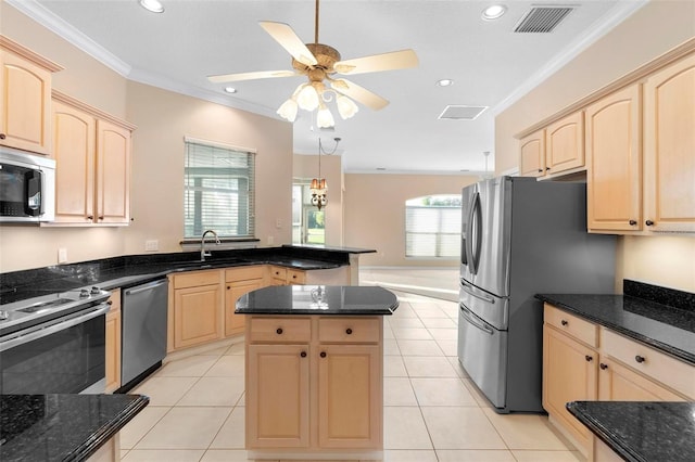 kitchen featuring crown molding, light tile patterned flooring, sink, and stainless steel appliances