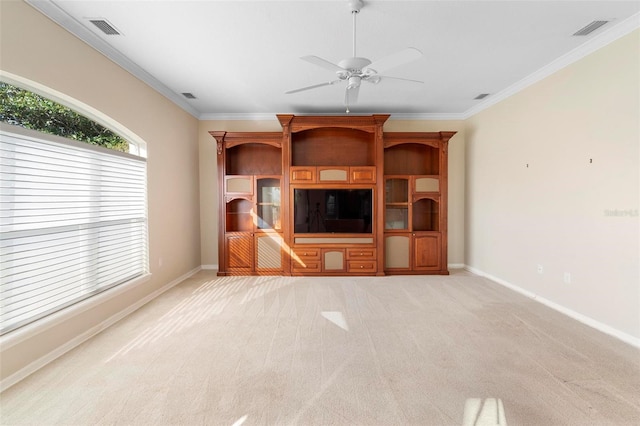 unfurnished living room featuring ceiling fan, light colored carpet, and ornamental molding