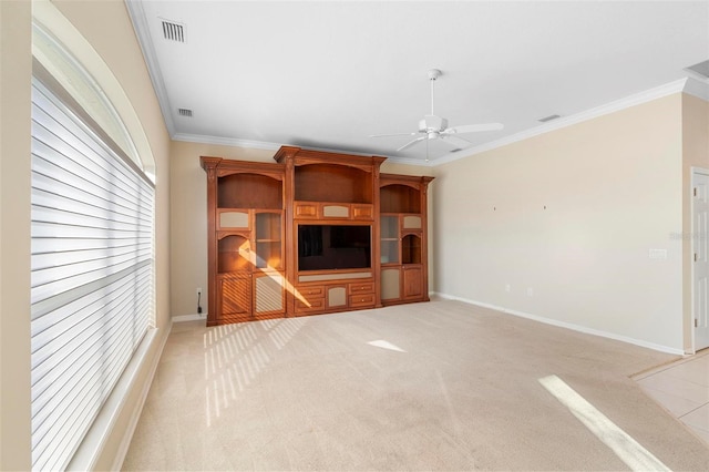 unfurnished living room with crown molding, ceiling fan, and light carpet