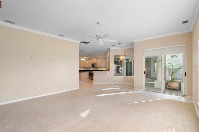 unfurnished living room with light carpet, ceiling fan with notable chandelier, and ornamental molding