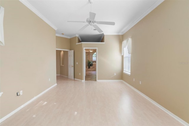 spare room featuring light hardwood / wood-style flooring, ceiling fan, and crown molding