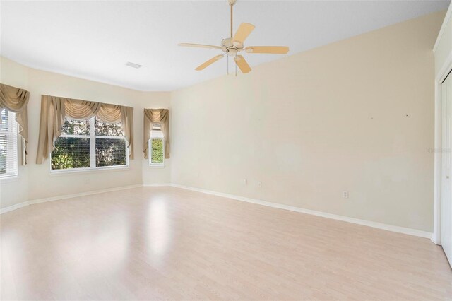 unfurnished room with light hardwood / wood-style flooring and ceiling fan