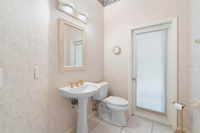 bathroom featuring tile patterned floors, sink, and toilet