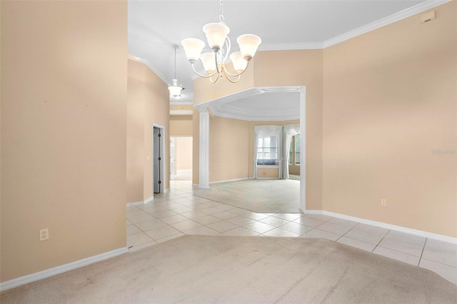 tiled spare room featuring crown molding and a notable chandelier