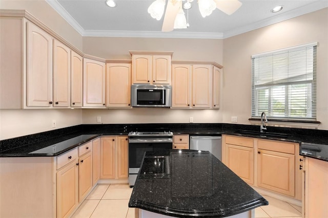 kitchen featuring sink, light brown cabinets, dark stone countertops, and stainless steel appliances