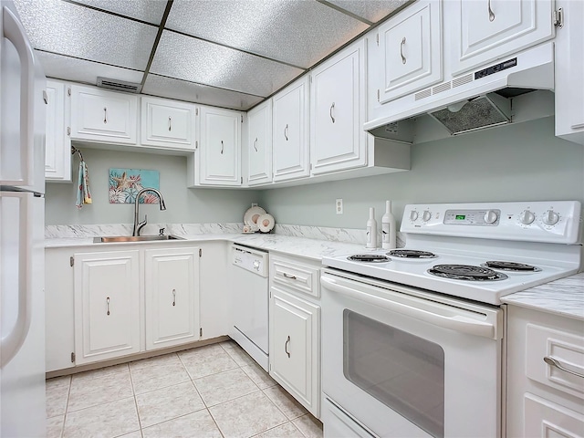 kitchen with white cabinetry, white appliances, and sink