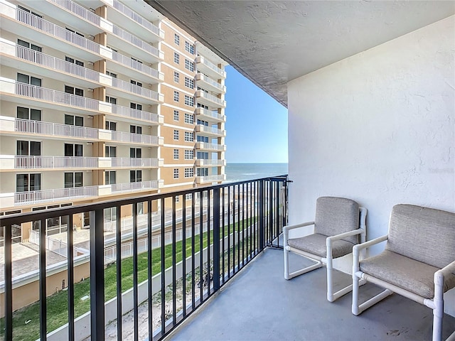 balcony featuring a water view