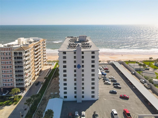 bird's eye view featuring a water view and a view of the beach