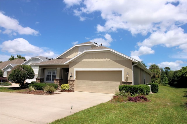 view of front of house with a garage and a front yard