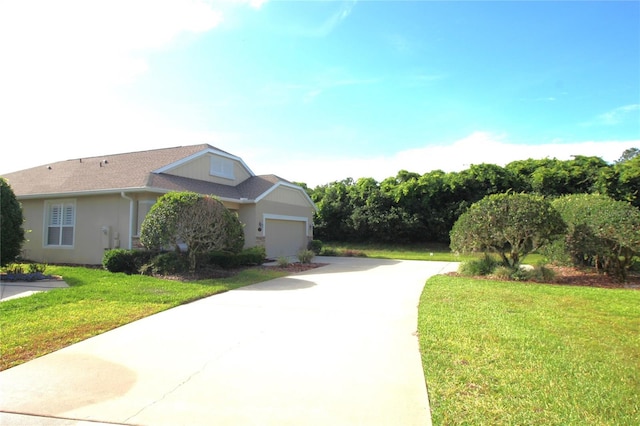 exterior space with a garage and a lawn