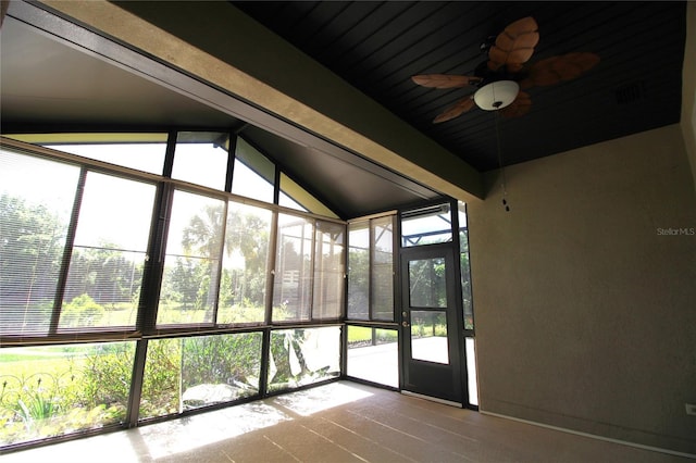 unfurnished sunroom with lofted ceiling and ceiling fan