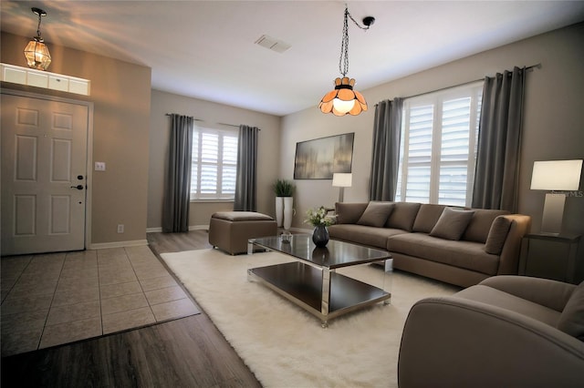 living room with plenty of natural light and hardwood / wood-style flooring