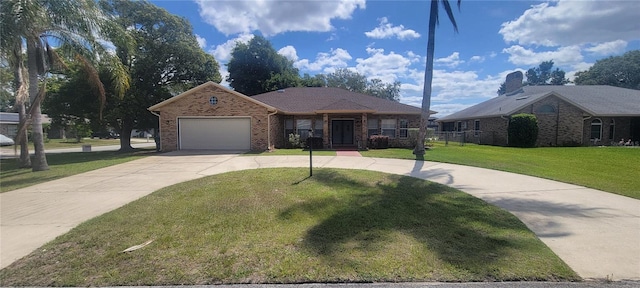 ranch-style home with a garage and a front yard