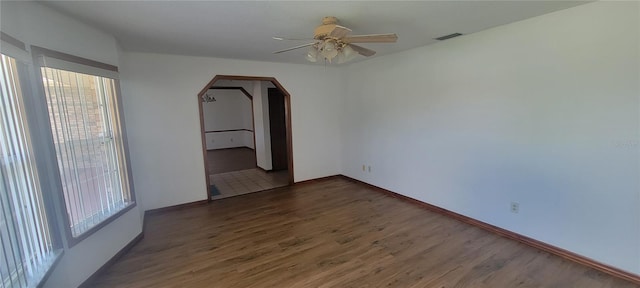 empty room featuring ceiling fan and hardwood / wood-style flooring