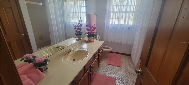 bathroom with toilet, tile flooring, and large vanity