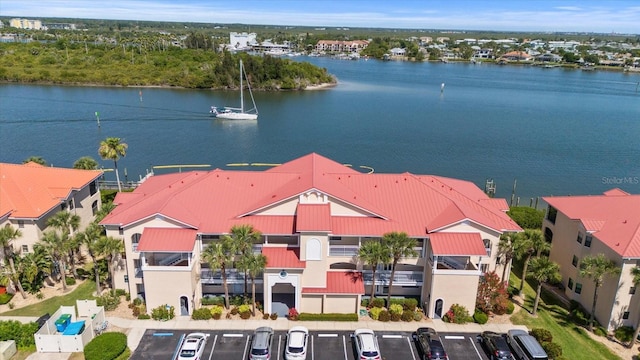 drone / aerial view with a water view