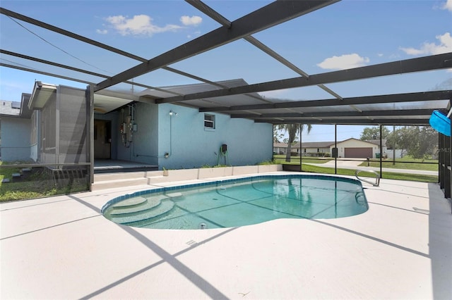 view of swimming pool featuring glass enclosure and a patio area