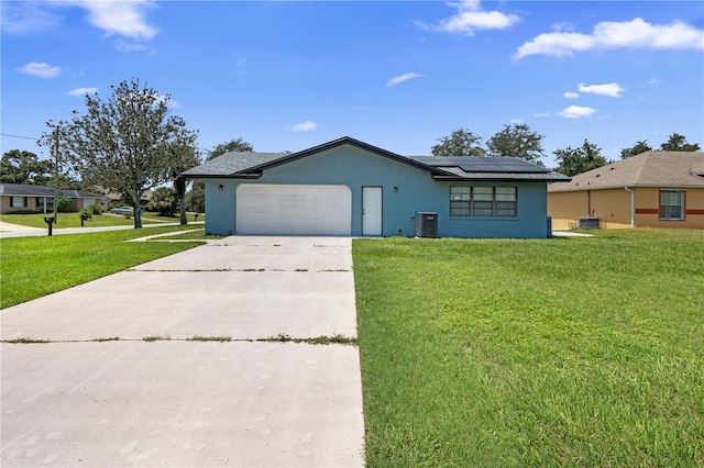 ranch-style home featuring a garage, central air condition unit, and a front lawn