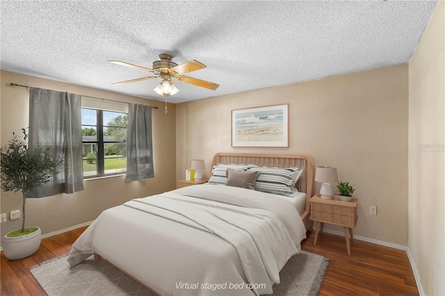 bedroom featuring ceiling fan, a textured ceiling, and dark hardwood / wood-style floors