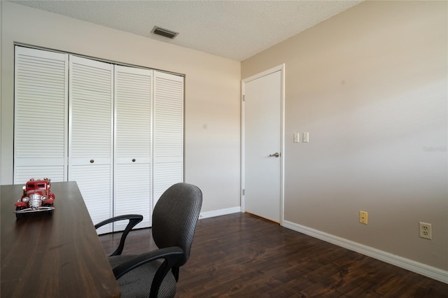 office featuring a textured ceiling and dark hardwood / wood-style flooring