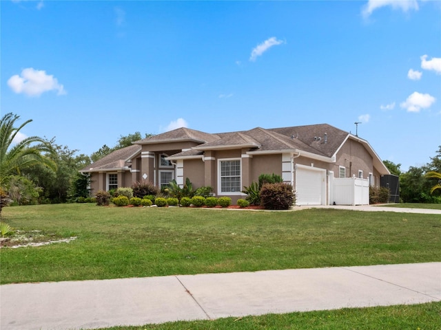 view of front of property with a garage and a front yard