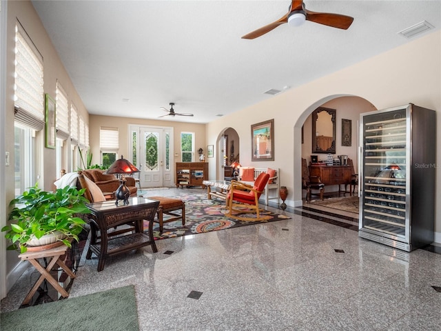 living room with french doors and ceiling fan