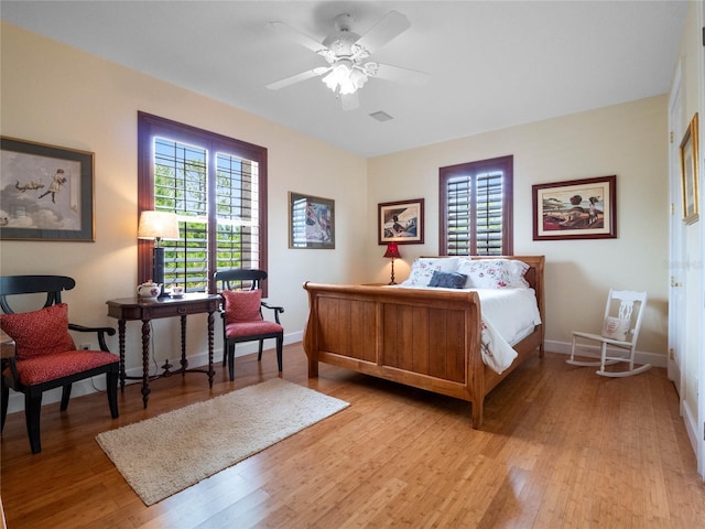 bedroom with ceiling fan and light wood-type flooring