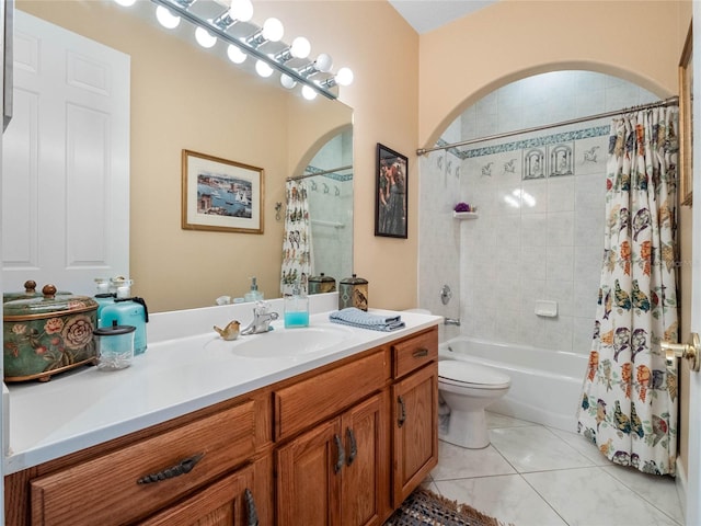 full bathroom with tile flooring, shower / tub combo with curtain, toilet, and vanity