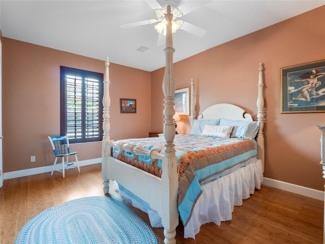 bedroom featuring hardwood / wood-style flooring and ceiling fan