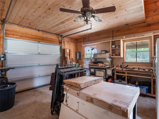 garage featuring ceiling fan and wood ceiling