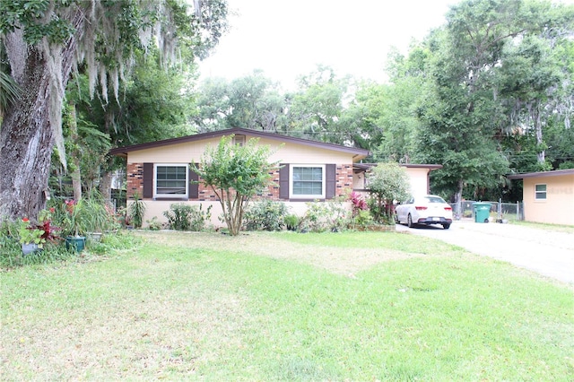 ranch-style home with a front yard