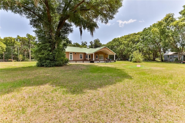 view of yard with covered porch