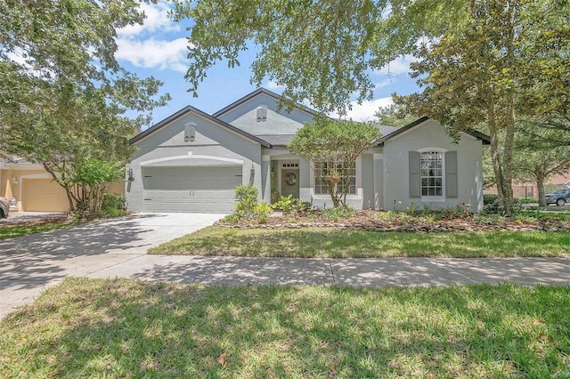 ranch-style home featuring a garage and a front yard