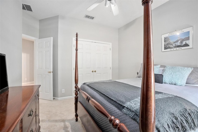 bedroom with light carpet, a closet, and ceiling fan